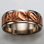 14 karat white gold flat band with reticulated 14 karat rose gold sheet overlay.