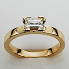 14 karat yellow gold flat band with 0.90 carat emerald-cut diamond in semi-semi-bezel(modified to 4-corners).