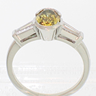 Platinum ring with 1.14 carat natural cinnamon-green fancy colored diamond with 0.46 carat total weight (0.23 ct. each)tapered baguettes. (alternate view)