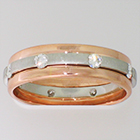 14 Karat Rose Gold Band with Platinum overlay with intermittent flush-set round diamonds