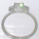 3 princess-cut diamonds set into platinum bezels