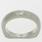 Palladium solitaire with 0.15 carat round brilliant diamond flush-set in brushed heavy shank