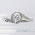 Platinum wrap-around diamond solitaire