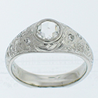 Platinum hand-engraved heavy gypsy-style ring with 0.56 carat rose-cut diamond in low-profile bezel with millgrain detail