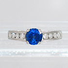 Platinum Hand-engraved 4-prong Sapphire ring with channel-set diamonds (alternate view)