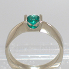 14 Karat White Gold Solitaire ring with round Emerald in Square saddle setting