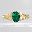 14 Karat Yellow Gold Celtic Solitaire ring with Oval-shaped emerald in 6-prong crown-style setting