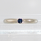 14 Karat White Gold barstock band with flush-set round blue sapphire (alternate view)