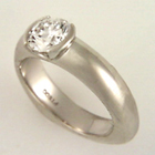 platinum ring with round diamond in semi-bezel