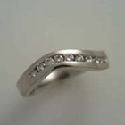 platinum subtle-wave band with channel-set diamonds.