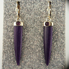 dangle earrings with caboschon-cut pyrope garnets and long bullet-shaped sugilite.