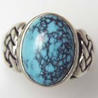 14 karat white gold turquoise ring with celtic knot detail.